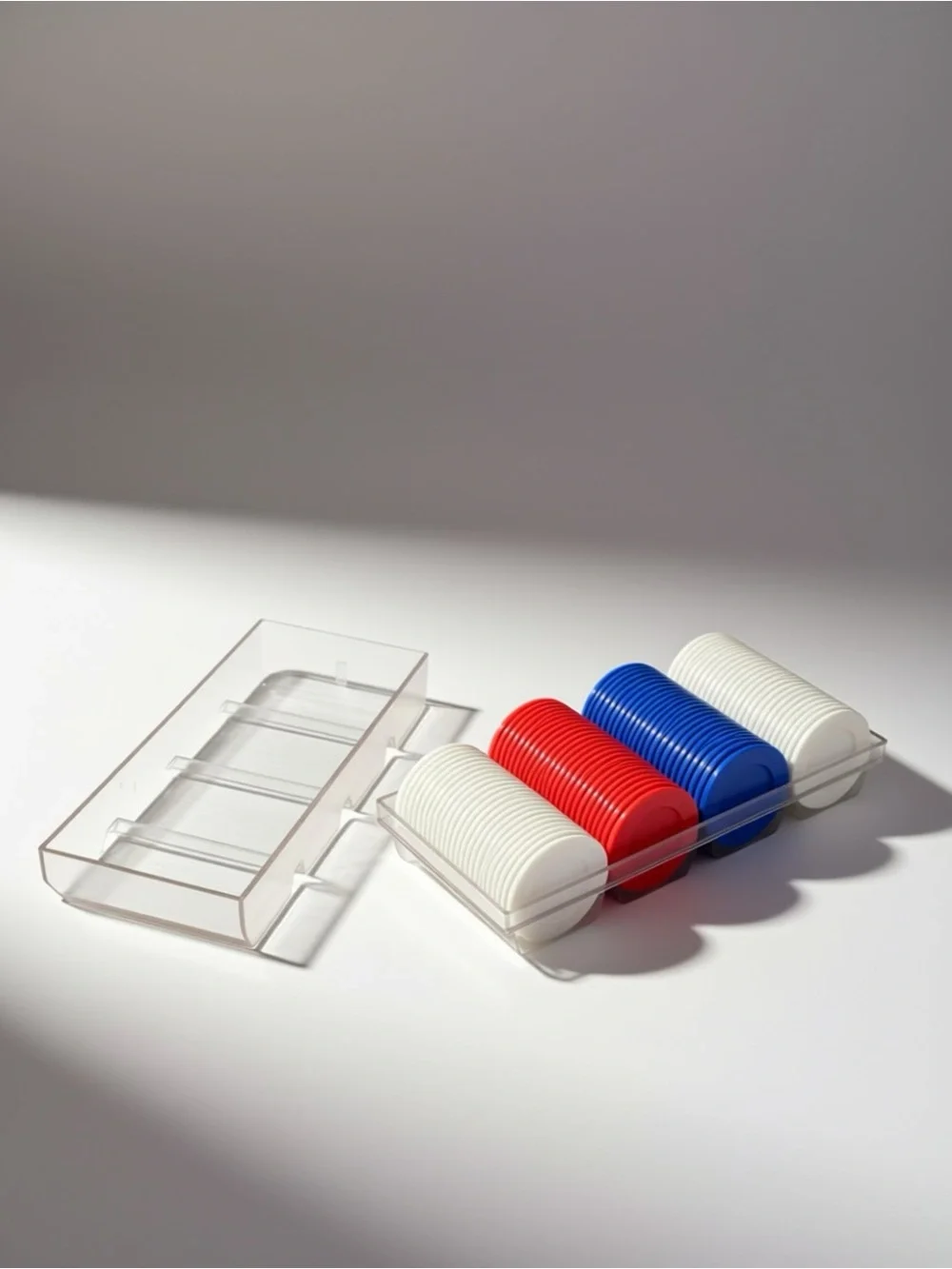 Red, Blue and White Poker Chips in Clear Case